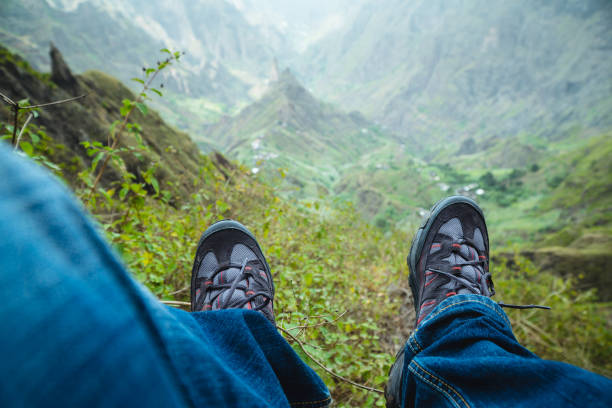 istock Traveler hiking boots over impressive verdant Xo-Xo valley with mountain peaks, rugged cliffs on Santo Antao Island, Cape Verde 962455678