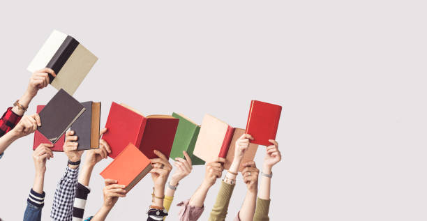 istock The hands of people hold books 962459440