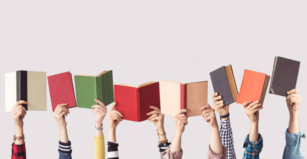 istock The hands of people hold books 962459570