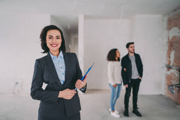 istock Real estate agent showing new home to clients 962459740