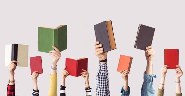 The hands of people hold books stock photo