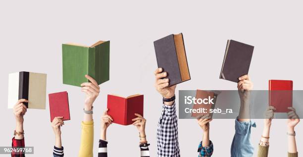 The Hands Of People Hold Books Stock Photo - Download Image Now - Book, Reading, Hand