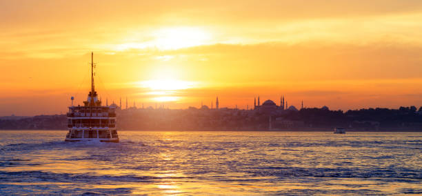 Passenger Ferry in the Bosphorus at sunset Passenger Ferry in the Bosphorus at sunset, istanbul, TURKEY hagia sophia istanbul photos stock pictures, royalty-free photos & images