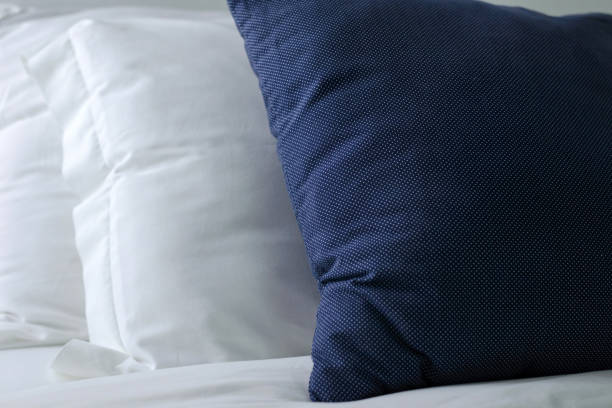 stacking of blue backrest pillow and white pillow on bed and white brick wall, interior modern bedroom stacking of blue backrest pillow and white pillow on bed and white brick wall, interior modern bedroomstacking of blue backrest pillow and white pillow on bed and white brick wall, interior modern bedroom backrest stock pictures, royalty-free photos & images