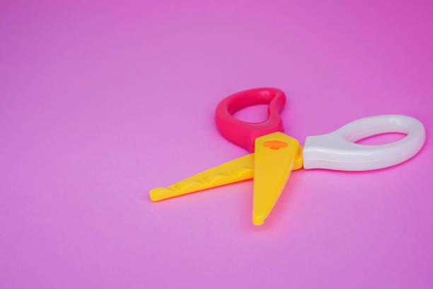 istock cute pastel zigzag plastic scissors on pink pastel background for handmade workshop 962464374