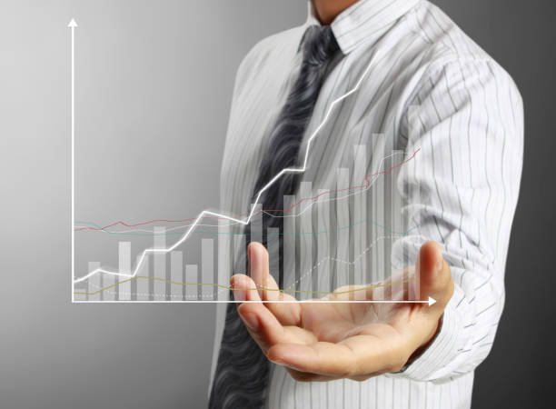 istock businessman with financial symbols coming 962464596