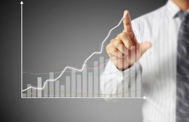 istock businessman with financial symbols coming 962464604