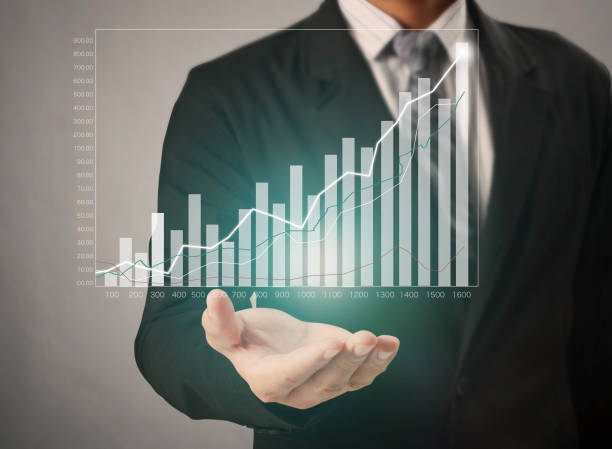 istock businessman with financial symbols coming 962464606