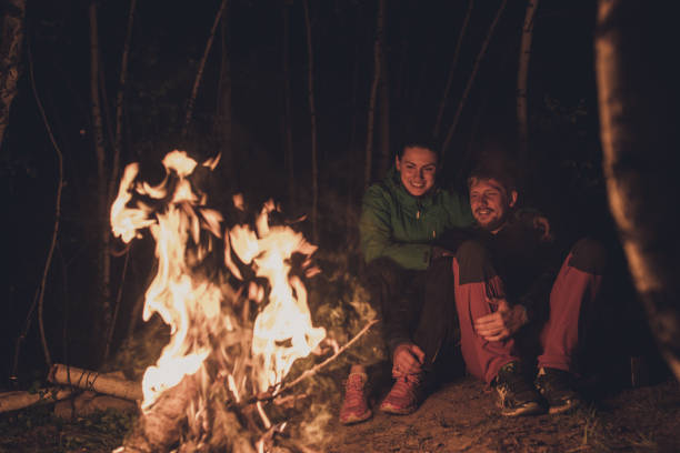 istock Young adult couple camping together 962465802