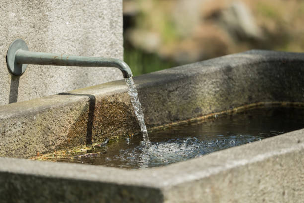istock Water flows from a tap at the stone fountain 962466478