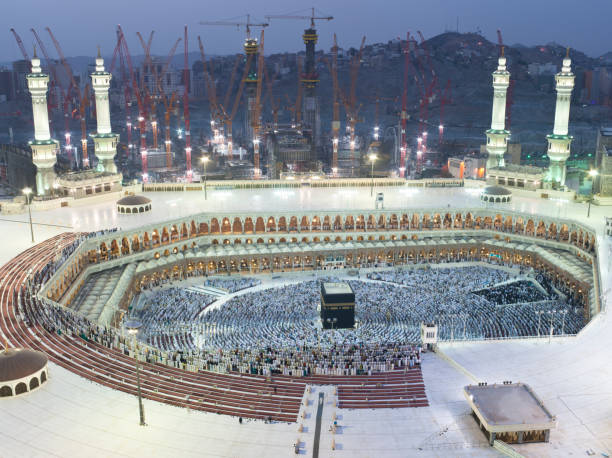 Prayer and Tawaf - circumambulation - of Muslims Around AlKaaba in Mecca, Aerial View Muslims Prayer Around AlKaaba in Mecca, Saudi Arabia, Aerial View kaabah stock pictures, royalty-free photos & images