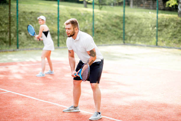 istock Couple playing tennis 962469920