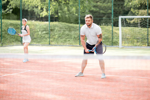 istock Couple playing tennis 962470062