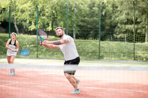 istock Couple playing tennis 962470096