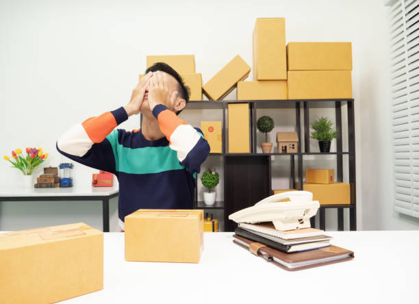 istock Young man with stress during work transport SME owner express delivery service, Answering questions to customers, hardworking. 962471096