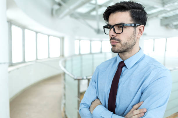 istock Young entrepreneur standing arms crossed 962472250