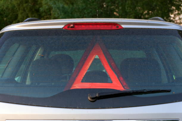 istock Red warning triangle is visible in the car - waiting for help 962472868