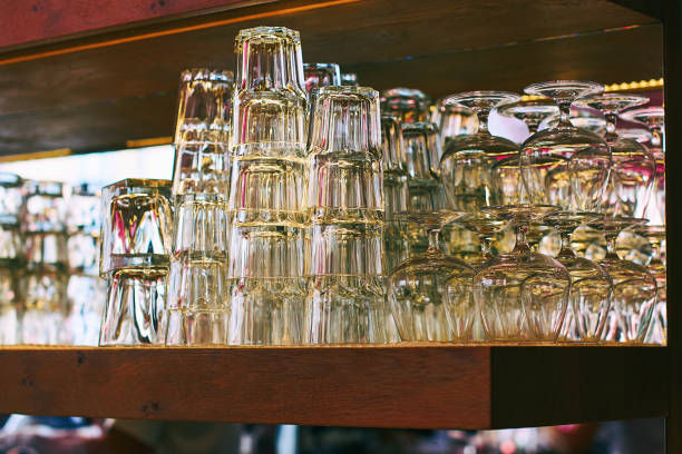 istock Different glassware and drinkware such as glasses and cognac snifters at a bar 962473544
