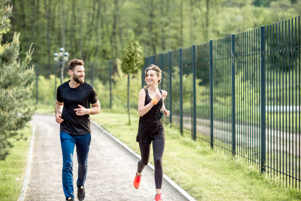 istock Couple jogging outdoors 962476512