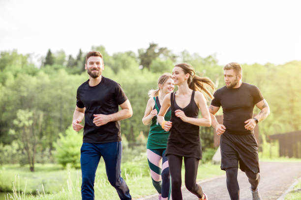 istock Friends jogging outdoors 962476682