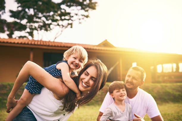 It's time for family quality time Shot of a happy family bonding together outdoors lens flare offspring daughter human age stock pictures, royalty-free photos & images