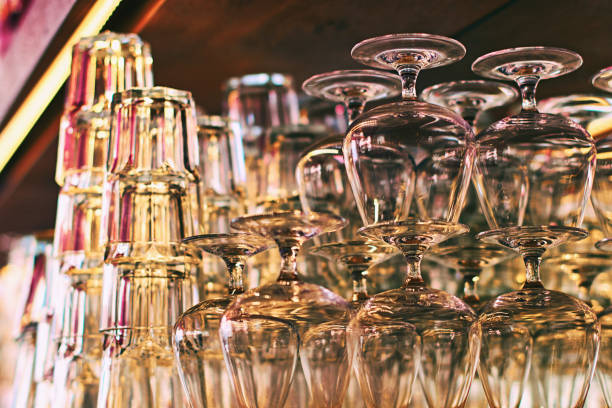 Different glassware and drinkware such as glasses and cognac snifters at a bar