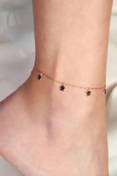 Photo of Woman Wearing Silver Anklet