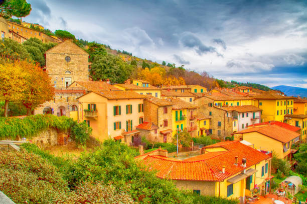 The view of the Tuscany city of Cortona, Italy Aerial panoramic view of houses in Tuscany city Cortona, Italy cortona stock pictures, royalty-free photos & images