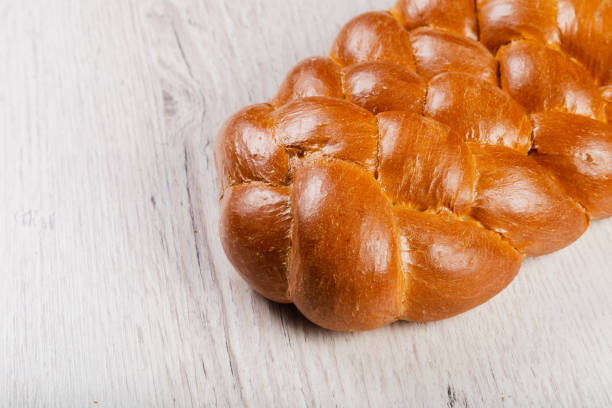 Freshly baked bread on a wooden background