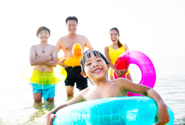 istock A cheerful kid in a float tube swimming 962484818