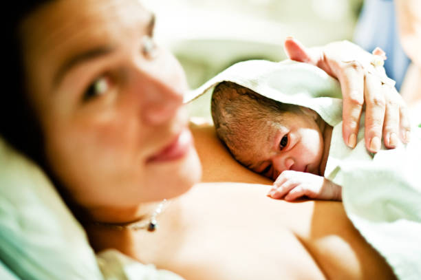 Maternal Bond: Mother And Child (New-born Baby) stock photo