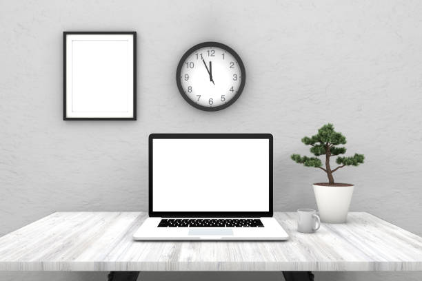 istock Laptop with blank screen on wooden desk 962485732