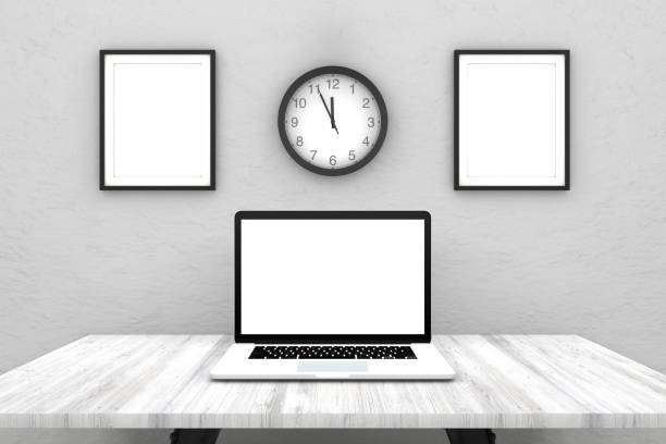 istock Laptop with blank screen on wooden desk 962485886