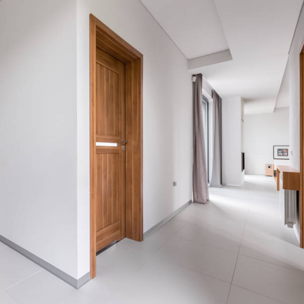 istock White apartment with wooden doors 962487218