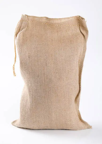 closed burlap sack on white background
