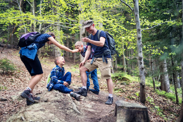 istock Family having fun hiking 962497232