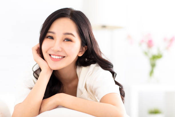 istock beautiful young woman relax on the sofa 962501368