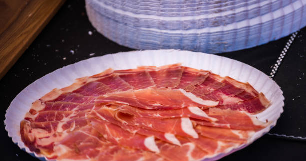istock plate with cut slices of jamon serrano, traditional Spanish ham 962508574
