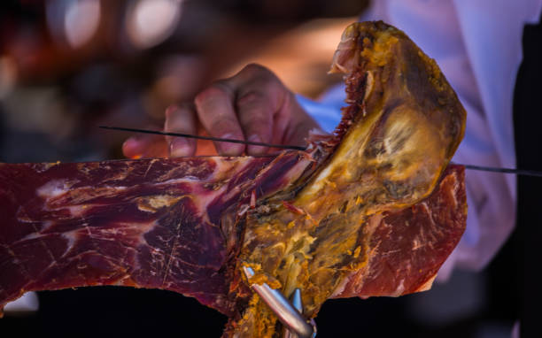 istock professional slicing jamon serrano, traditional Spanish ham 962509272
