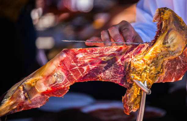 istock professional slicing jamon serrano, traditional Spanish ham 962509314