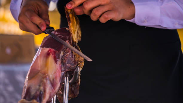 istock professional slicing jamon serrano, traditional Spanish ham 962509322