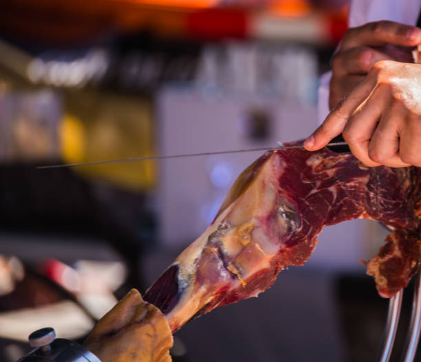 istock professional slicing jamon serrano, traditional Spanish ham 962509334