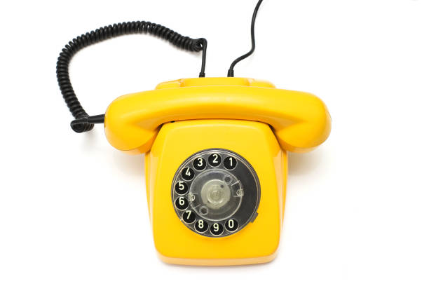istock Yellow retro telephone isolated on white background 962509504