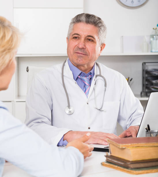 istock Professor of medicine training colleague 962511616