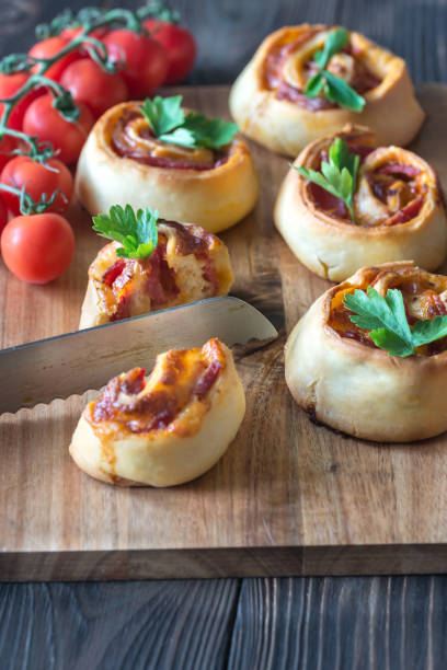 istock Pizza rolls on the wooden board 962512850