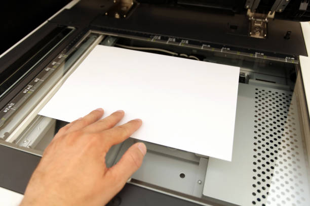 istock A person handling with working laser copier 962515346