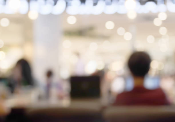 Interior atmosphere of public working space blur background with beautiful light bokeh.