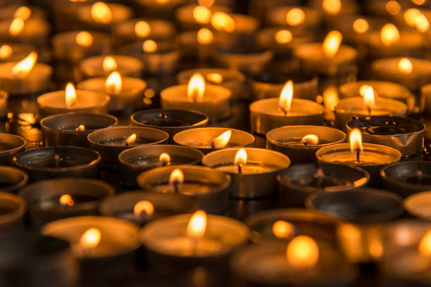 istock Prayer candles in a church 962516764