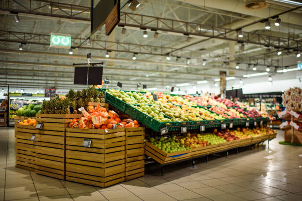 Supermarket Isles with food and drinks in the empty supermarket. produce section stock pictures, royalty-free photos & images