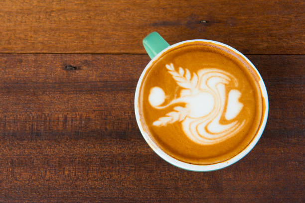 istock latte coffe art with wooden background 962519076